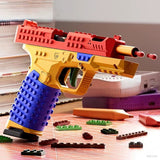 BrickOps blaster three-quarter angle, firing action